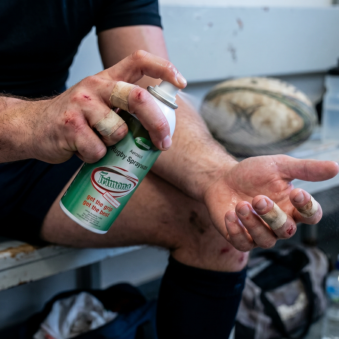 Trimona Spraywax getting sprayed on a rugby players hand